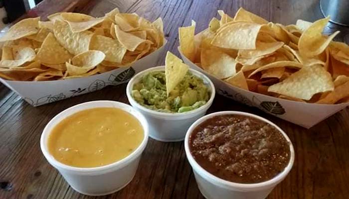 Tortilla chips, nacho cheese and homemade chili served at Bill's Burgers, Wings and Things in Burnet, TX